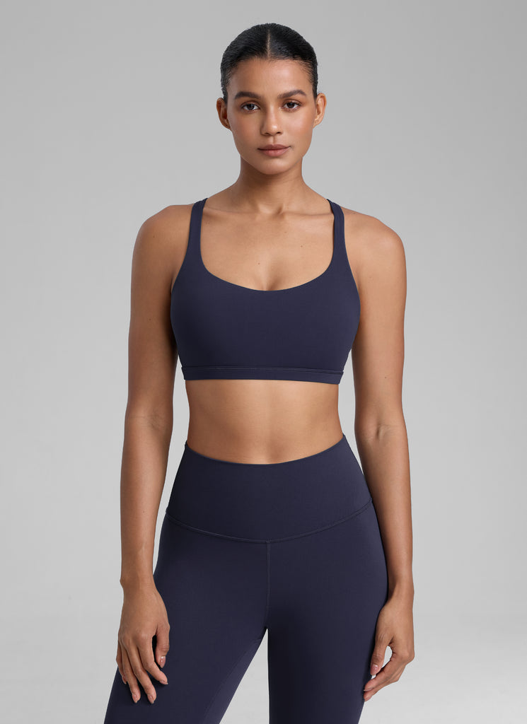 CRZ YOGA Women's Yoga Light Support Nakedfeel Strappy Bra Low Cut Navy
