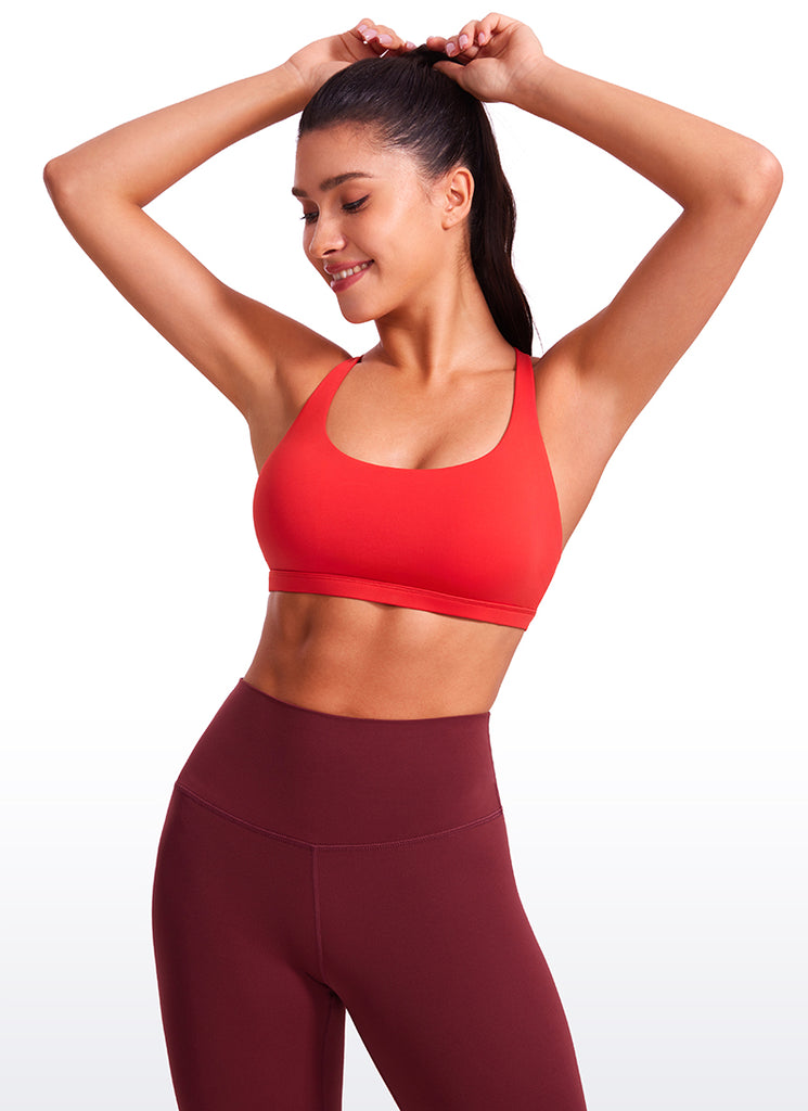 CRZ YOGA Women's Yoga Light Support Nakedfeel Strappy Bra Low Cut Deep Red