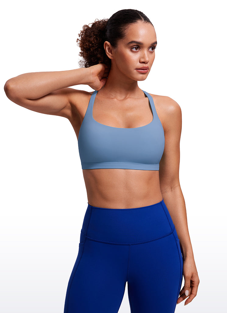 CRZ YOGA Women's Yoga Light Support Nakedfeel Strappy Bra Low Cut Oasis Blue