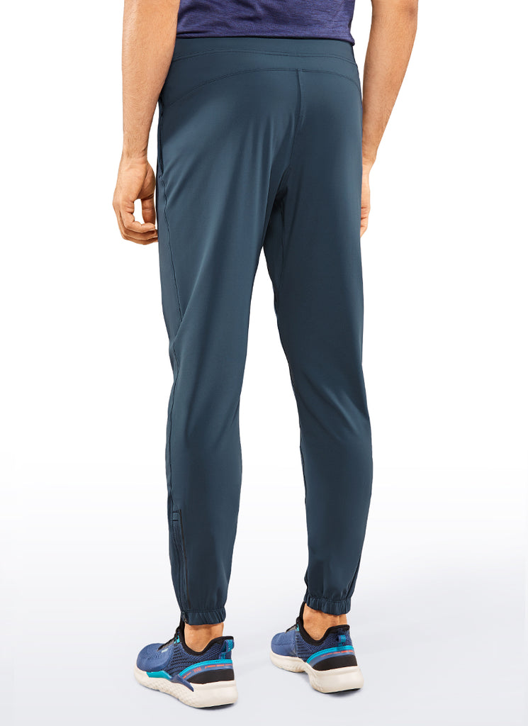 CRZ YOGA Men's Run Slim Fit On the Travel Joggers 30''- Ankle Zipper True Navy