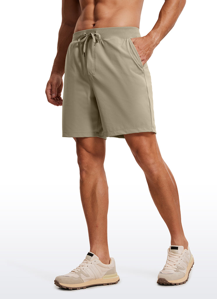 CRZ YOGA Men's Train Relaxed Fit On the Travel Linerless Shorts 7'' Dark Brown