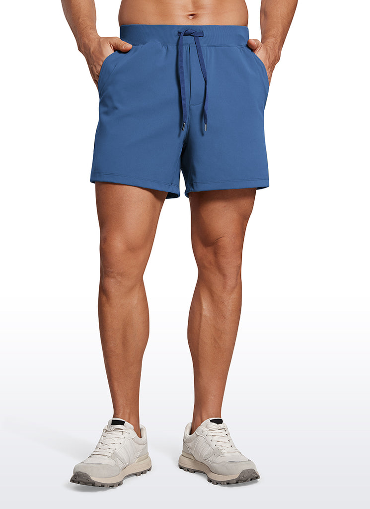 CRZ YOGA Men's Train Relaxed Fit On the Travel Linerless Shorts 5'' Pitch Blue