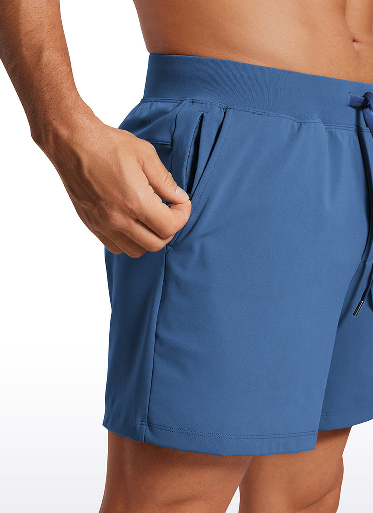 CRZ YOGA Men's Train Relaxed Fit On the Travel Linerless Shorts 5'' Pitch Blue