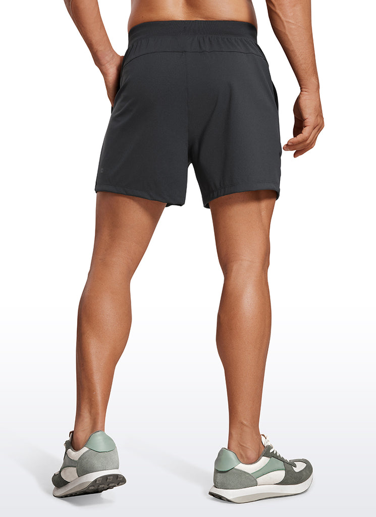 CRZ YOGA Men's Train Relaxed Fit On the Travel Linerless Shorts 5'' Ink Gray