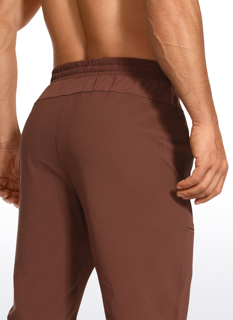 CRZ YOGA Men's Train Slim Fit Quick Dry Joggers 29''- Zip Pockets Dark Brown