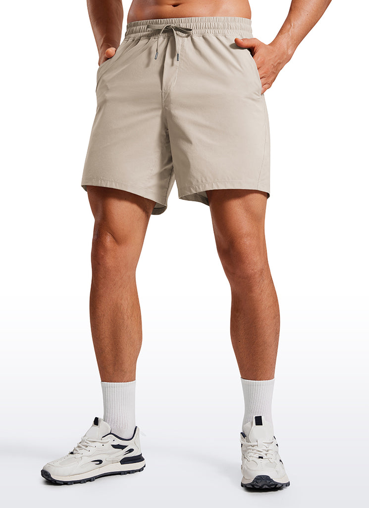 CRZ YOGA Men's Training Quick Dry Pocketed Linerless Shorts 7'' Khaki Sand