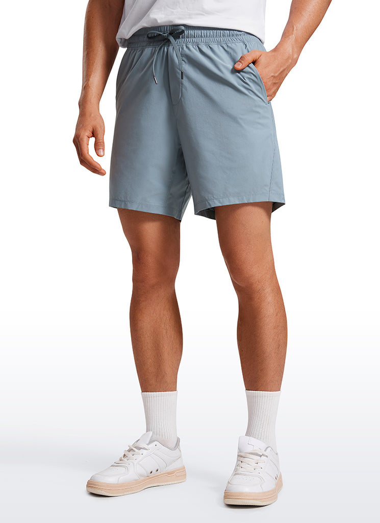 CRZ YOGA Men's Training Quick Dry Pocketed Linerless Shorts 7'' Stelindigo