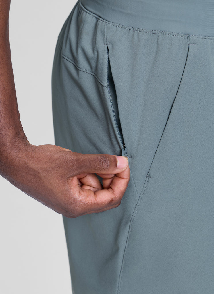 CRZ YOGA Men's Workout Classic FIt Quick Dry Pocket Shorts  7" Mojave Tan