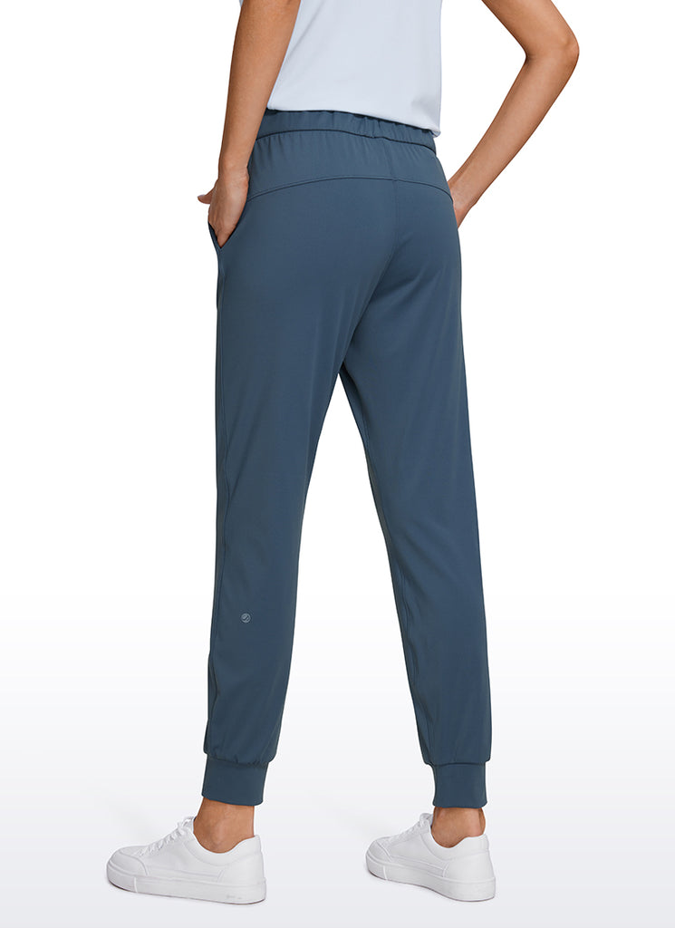 CRZ YOGA Women's Travel Slim Fit Stretch Drawstring Jogger 27'' Slate Blue