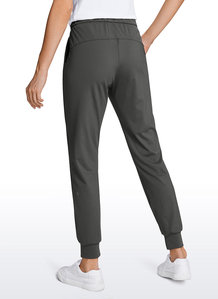 CRZ YOGA Women's Travel Slim Fit Stretch Drawstring Jogger 27'' Dark grey camouflage