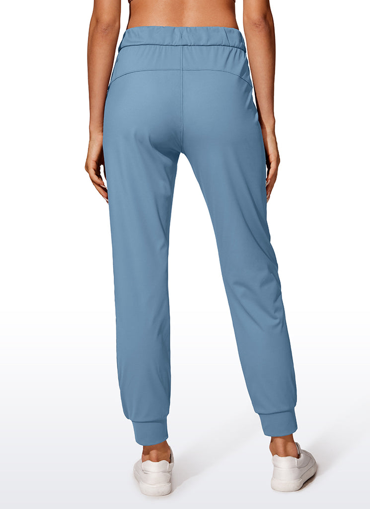 CRZ YOGA Women's Travel Slim Fit Stretch Drawstring Jogger 27'' Milky White