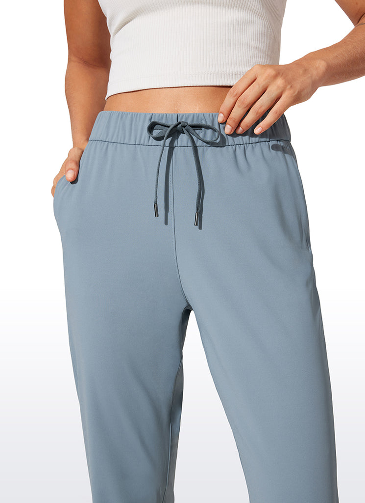 CRZ YOGA Women's Travel Slim Fit Stretch Drawstring Jogger 27'' Belgian Blue