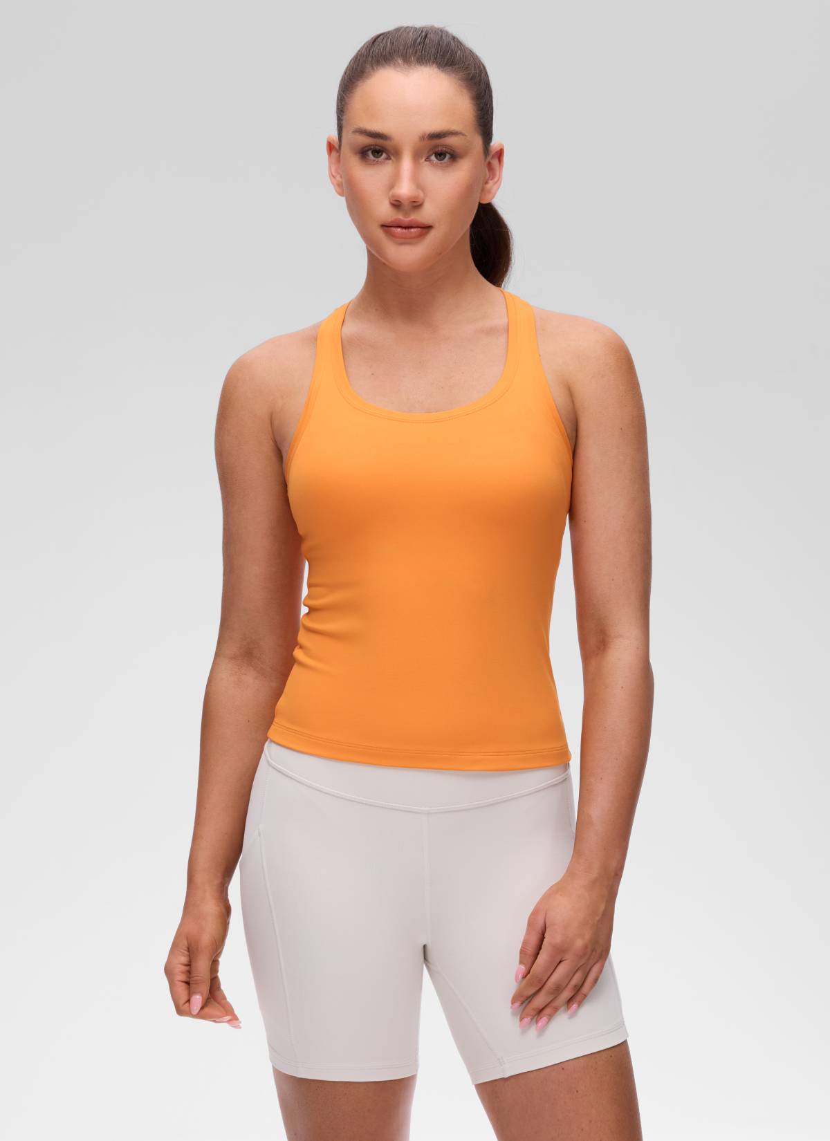 גופיית יוגה לנשים CRZ YOGA בגזרת Tight Fit Butterluxe עם צווארון עגול וגב רייסר, בצבע כתום טייגר