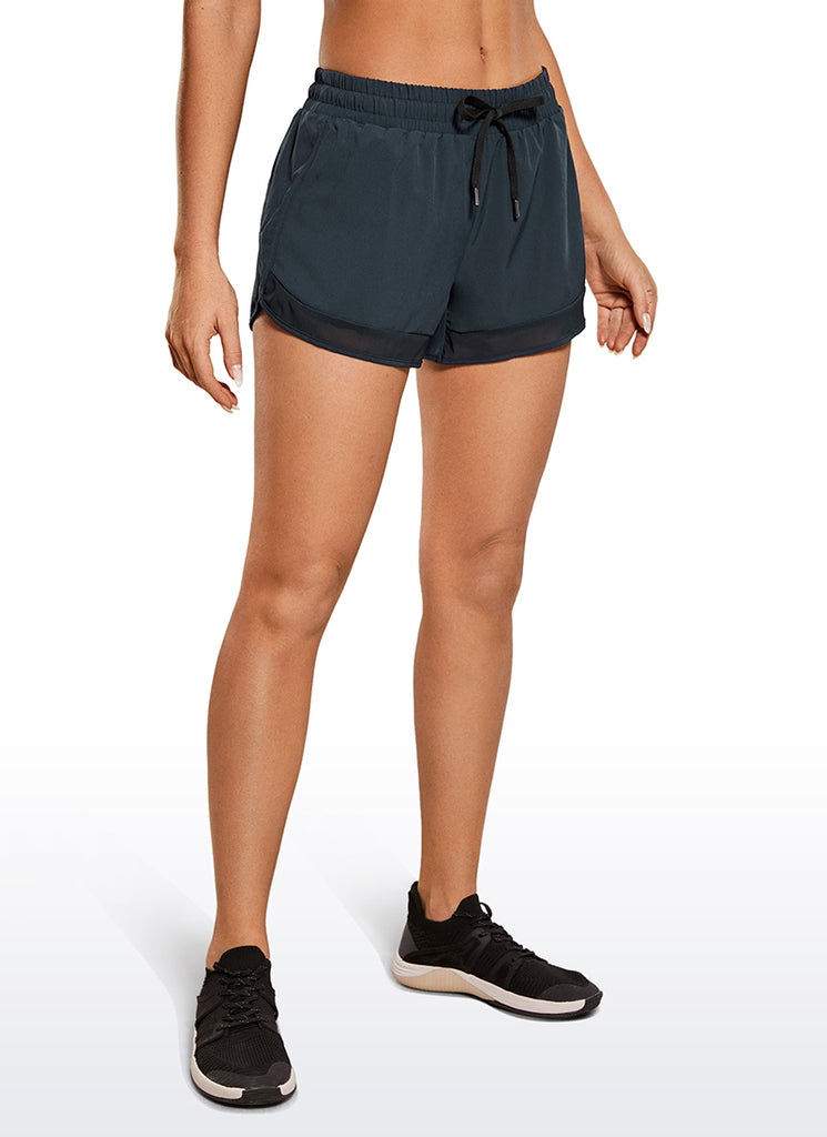 CRZ YOGA Women's Run Feathery-Fit Mid-Rise Lined Shorts Zip Pocket 3'' Black
