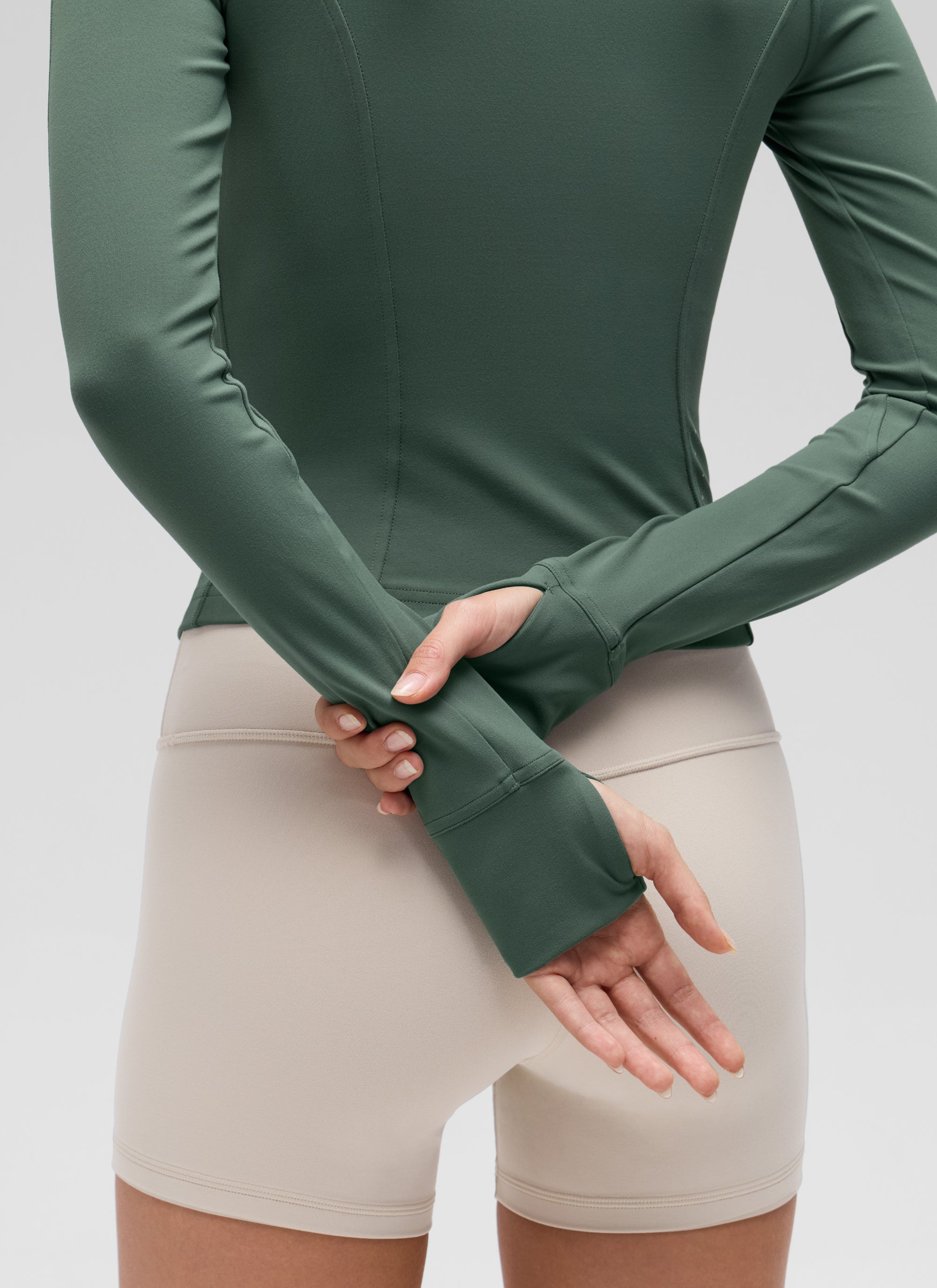 CRZ YOGA Women's Butterluxe Cropped Pocket Outerwear Full Zip Jackets Dark Forest Green @model_info:Anna