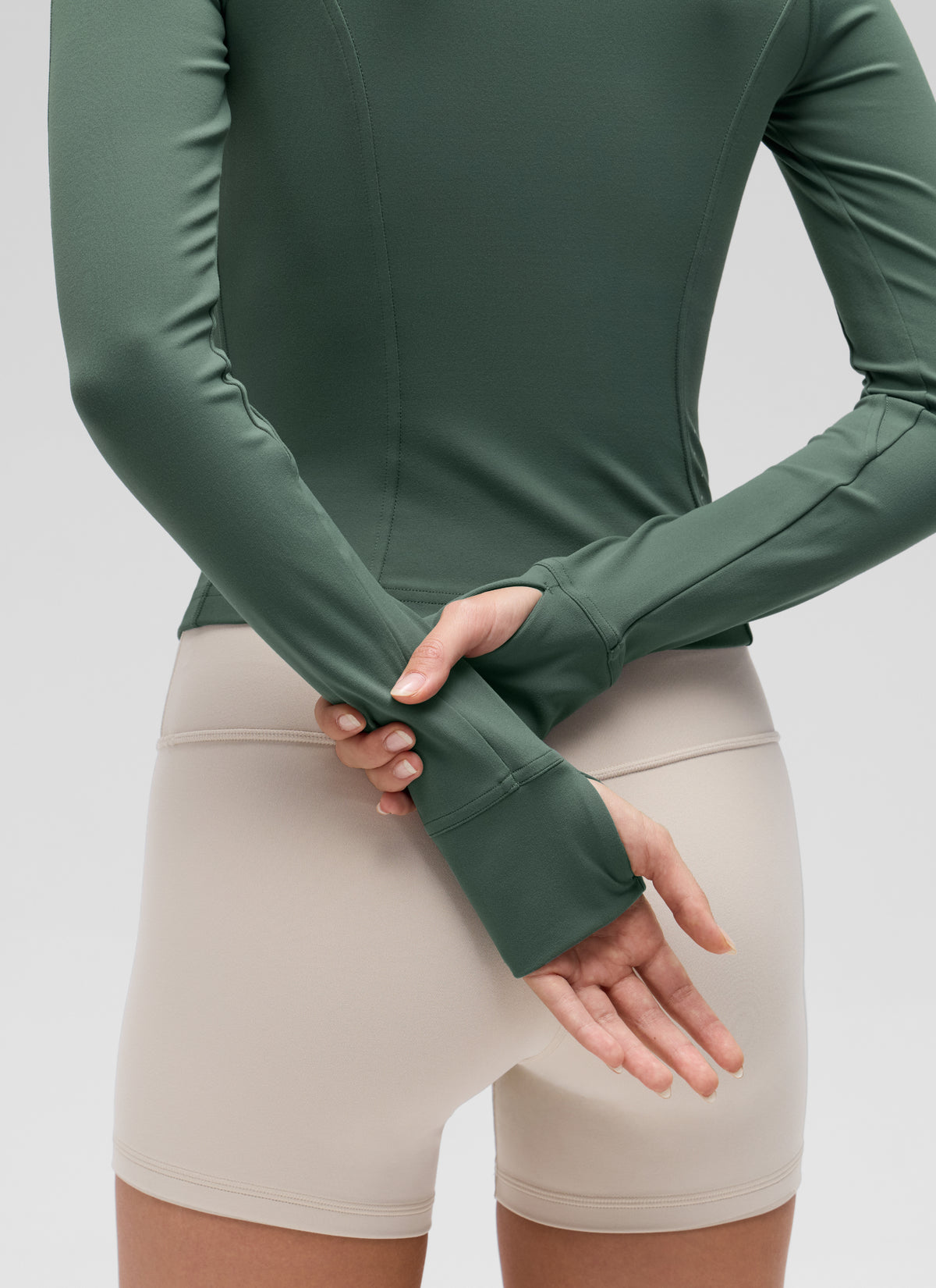 CRZ YOGA Women's Butterluxe Cropped Pocket Outerwear Full Zip Jackets Dark Forest Green @model_info:Anna